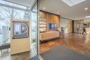 an atm machine in the lobby of a building at Hotel St Elisabeth in Allensbach