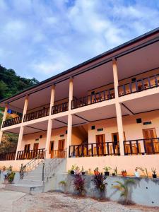 a building with steps and balconies on it at phoulisack2 guesthouse in Nongkhiaw +19 photos