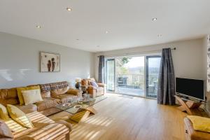 a living room with a couch and a tv at 4 Bed in Goodwick oc-s34887 in Goodwick