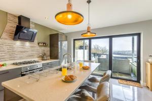 a kitchen with a large island with a counter top at 4 Bed in Goodwick oc-s34887 in Goodwick