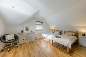a bedroom with a bed and a desk and a chair at 4 Bed in Goodwick oc-s34887 in Goodwick