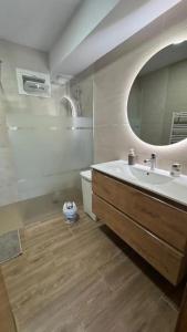 a bathroom with a sink and a mirror at Casa rural Solpor in Vigo +10 photos