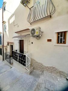 a building with a fan on the side of it at Mare' in Vieste