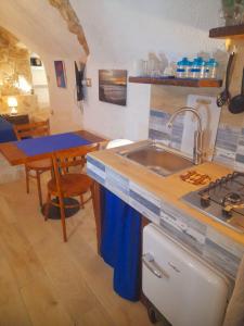 a kitchen with a sink and a counter top at Mare' in Vieste +18 photos