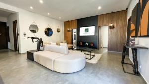 a living room with a white couch and a table at Beautiful Asma Villa with pool in Marrakesh
