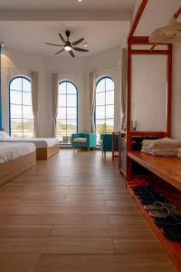 a bedroom with two beds and a large mirror at Santonita Hotel & Tours in Ninh Hải