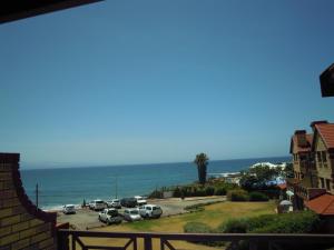 a view of a parking lot and the ocean at King Fisher 6 in Mossel Bay +5 photos