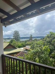 a view from the balcony of a house at Lago Calima Hostel in Calima