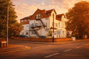a large white building on the side of a street at The Fairhaven Hotel in Nottingham