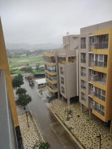 an aerial view of two apartment buildings and a street at Apartment in Igatpuri! in Igatpuri +3 photos