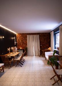 a living room with a table and chairs at Villa FOREST in Poznań