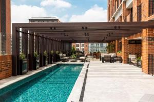 a patio with a swimming pool on a building at Studio Apartment Zona 10 near airport in Estación Pamplona