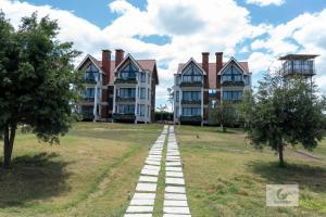 a large house with a pathway in front of it at Boynuz Hotels in Nyahururu