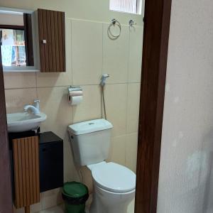 a bathroom with a toilet and a sink at Paim`s Village Itacaré in Itacaré +46 photos