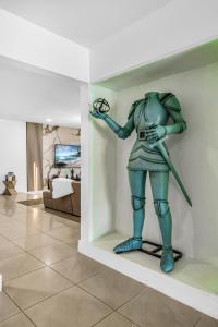 a statue of a person holding a ring in a room at Miami Paradise Waterfront Games in North Miami Beach