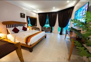 a bedroom with a bed and a large window at Casa Negrense Private Resort in Dauin +16 photos