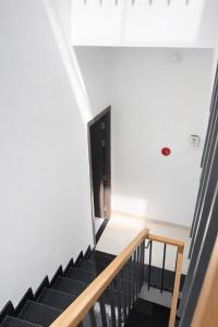 a stairway with a black and white stair case at The One Apartments in Tân Uyên