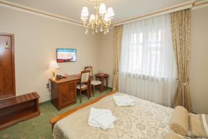 Postel nebo postele na pokoji v ubytování Hotel przy Młynie