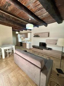 a living room with a couch and a table at Casetta n'da civita in Castrovillari