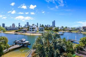 a view of a river with a city in the background at Wanderlust heated pool rooftop deck in Gold Coast