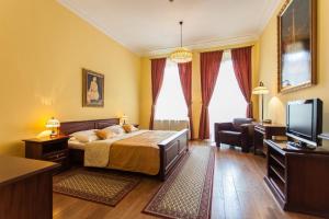 Televízia a/alebo spoločenská miestnosť v ubytovaní Boutique Hotel Carpe Diem