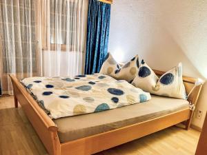 a bedroom with a bed with pillows and a window at Apartment Diana by Interhome in Münster