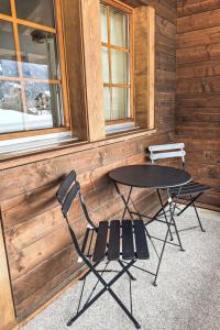 a table and two chairs in front of a cabin at Apartment Diana by Interhome in Münster