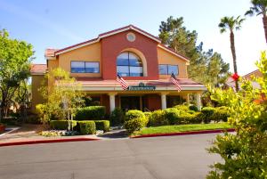 a house with two american flags in front of it at Westgate Flamingo Bay Resort in Las Vegas