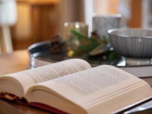 an open book sitting on top of a table at Chalet Ropiar by Interhome in Ovronnaz +28 photos