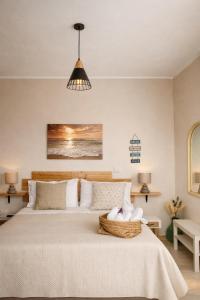 a bedroom with a bed with a basket on it at Villa Corocael in Castellabate