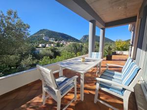 a patio with a table and chairs on a balcony at Apartment Waterfront Oasis-3 by Interhome in Mali Ston