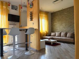 a living room with a couch and a table at La Concordia in Novi Ligure