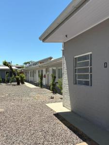 a row of houses parked next to a building at Morá 2 Coliving in Cachoeirinha