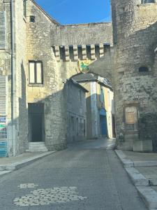 an alley in a stone building with an archway at nid douillet in La Roche-Posay