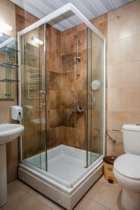 a shower with a glass door in a bathroom at District&Villa De Lago in Ohrid +114 photos