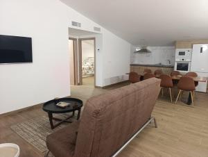 a living room with a couch and a table at Casa rural El Terreno in Teruel