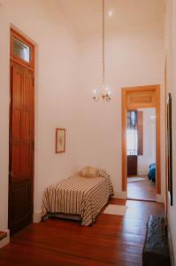a bedroom with a bed in the corner of a room at Mayo apparts in Esperanza