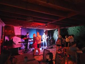 a group of people standing on a stage at ZEcamping 3 étoiles avec piscine chauffée - bar et restaurant in Pézenas +14 photos
