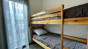 a bunk bed in a room with a bunk bed gmaxwell gmaxwell gmaxwell gmaxwell at Apartament DARSENA B 2-2 in L'Estartit +13 photos