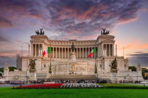 a large building with flags in front of it at Best Western Hotel Piccadilly in Rome