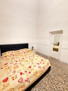 a bedroom with a bed with a bedspread with hearts on it at Scorcio Sul Mare in Gallipoli +11 photos