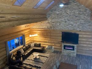 an overhead view of a living room with a couch and a television at Cougar Mountain Lodge and Resort Cabin Rentals in Valemount