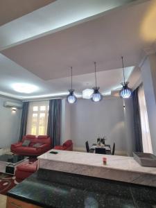 a living room with a couch and a table at Legacy Homes in Dar es Salaam +109 photos