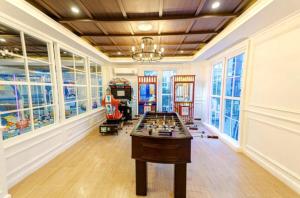 a room with a chess table in the middle at Seven Seas Code di Azur in Na Jomtien