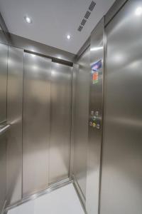 an elevator in a building with stainless steel at Urban Vibe 3 in Kirkop