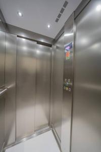 an elevator in a building with a metal door at Urban Vibe 1 in Kirkop
