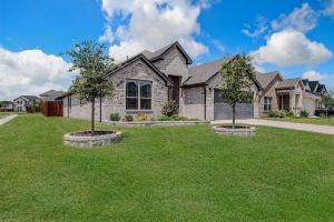 a house with two trees in front of it at Where Comfort Meets Convenience in Burleson