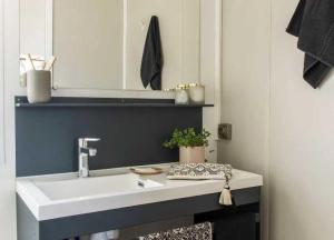 a bathroom with a sink and a mirror at Camping 4 etoiles - Espace aquatique - 500m plage - ccagefg in Portiragnes +117 photos