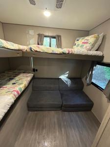 a small room with two bunk beds and a window at Family Friendly Camping in Crystal River in Crystal River +31 photos