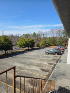 a parking lot with cars parked in it at Hotel Deerfield Inn & Suites Acworth Atlanta in Acworth
